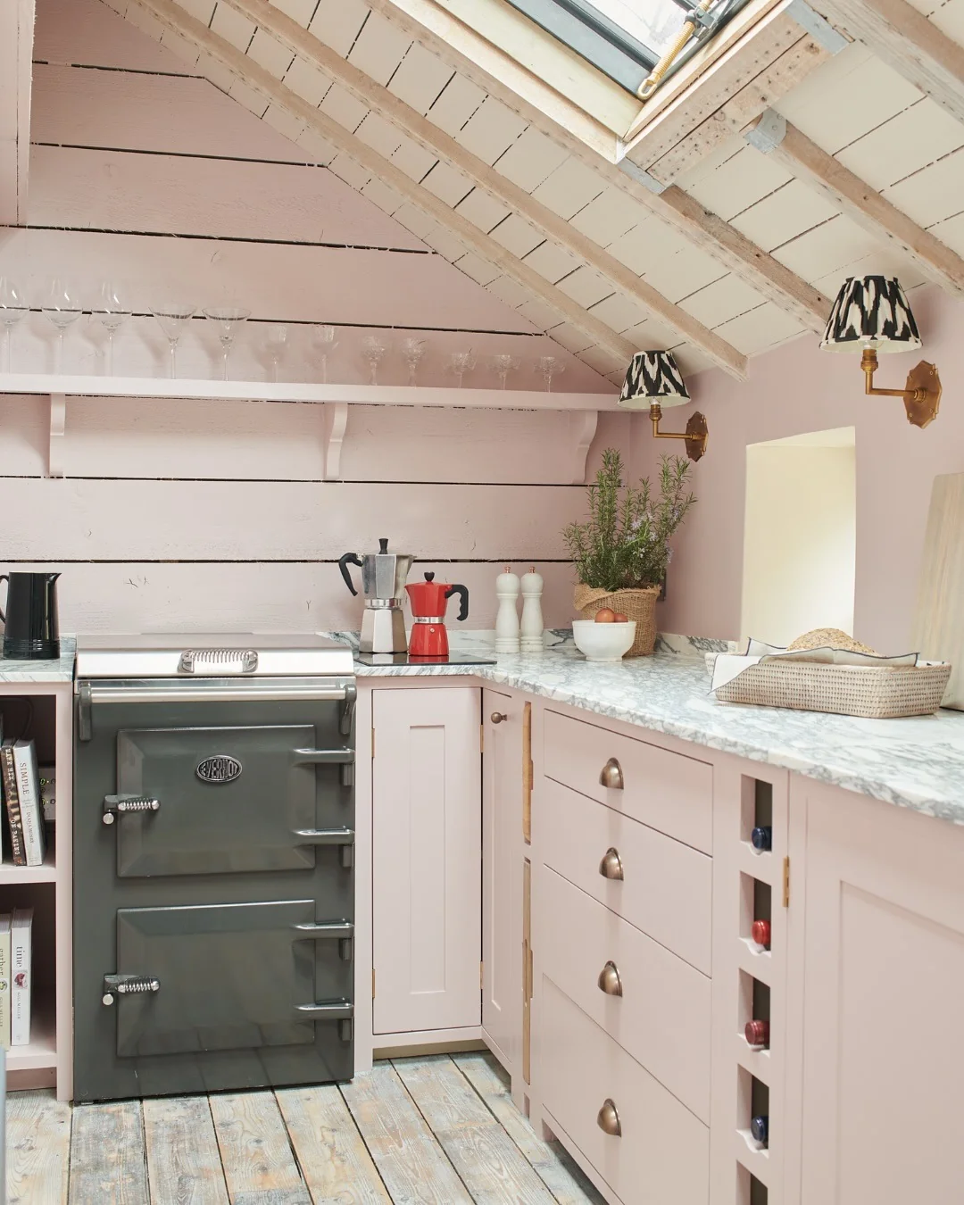 Pink Cabinets With Built-In Vertical Wine Cubbies
