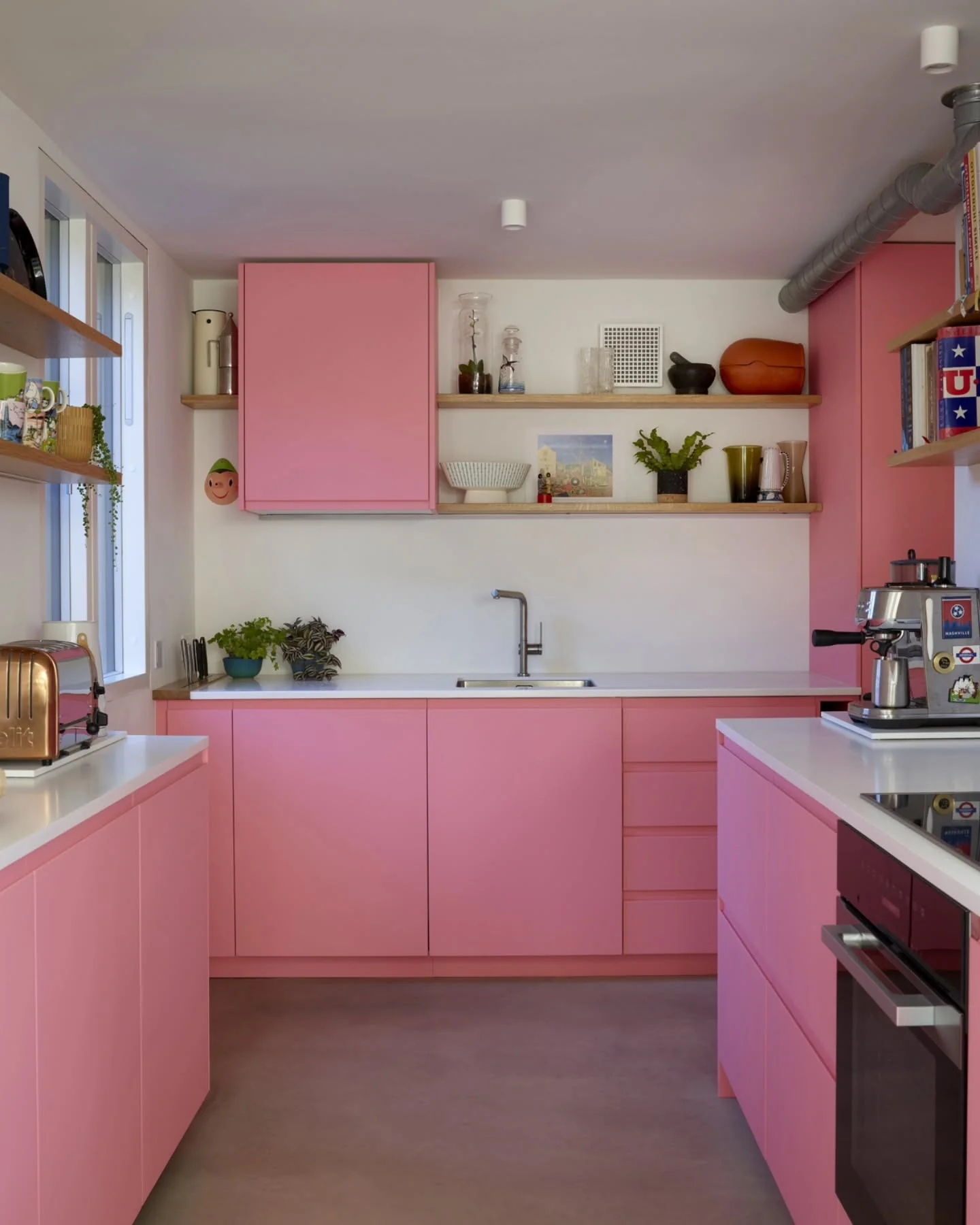 Sleek Pink Cabinets With Integrated Drawer Pulls