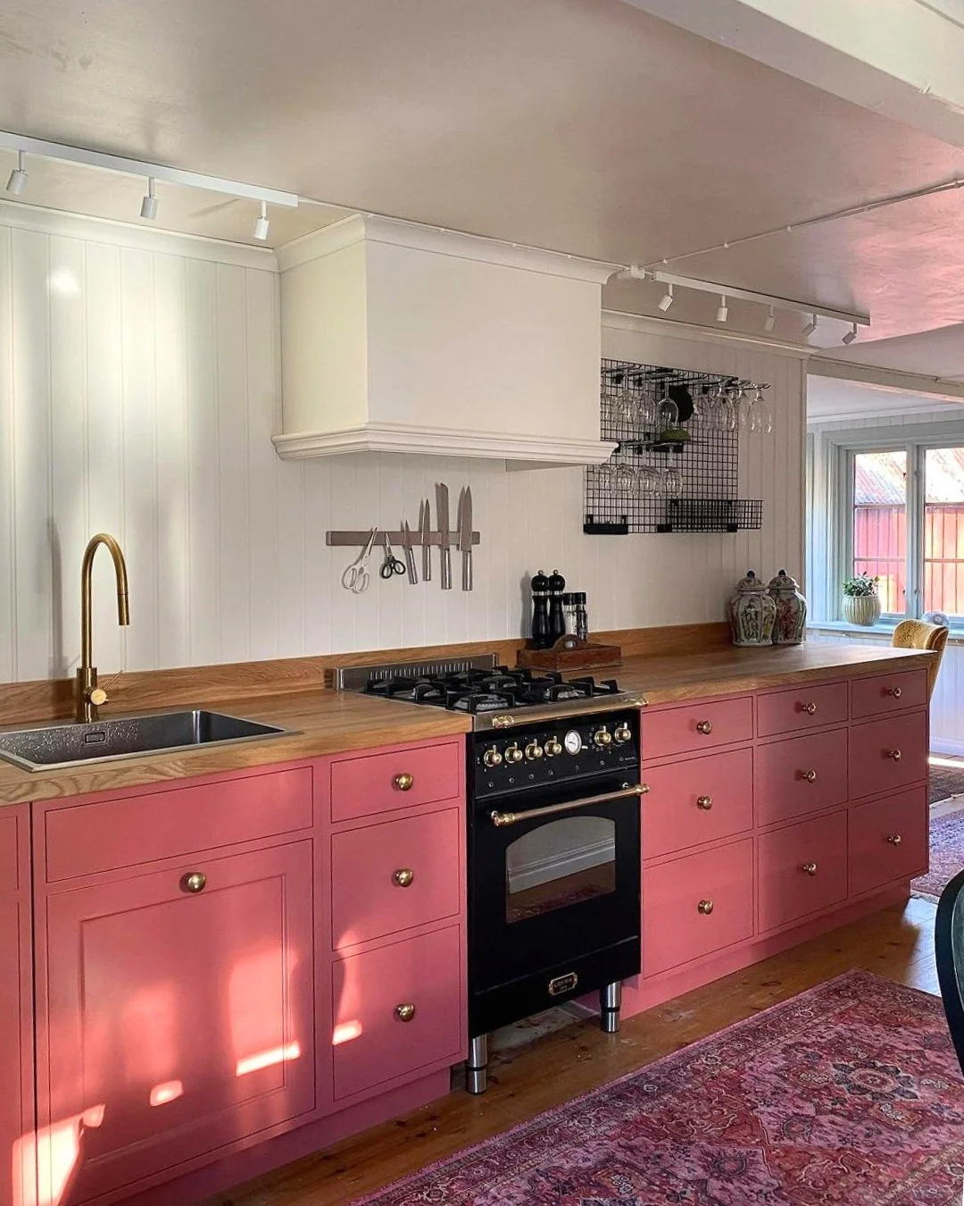 Pink Cabinets With Brass Knobs Add a Pop of Color