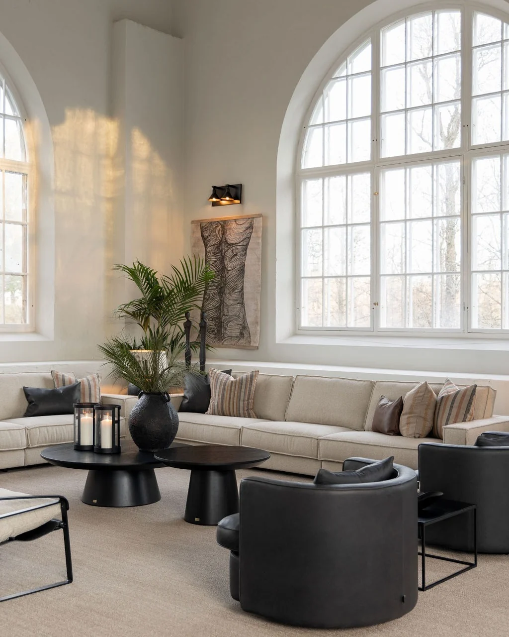 Layered Pedestal Coffee Tables Create a Dynamic Centerpiece