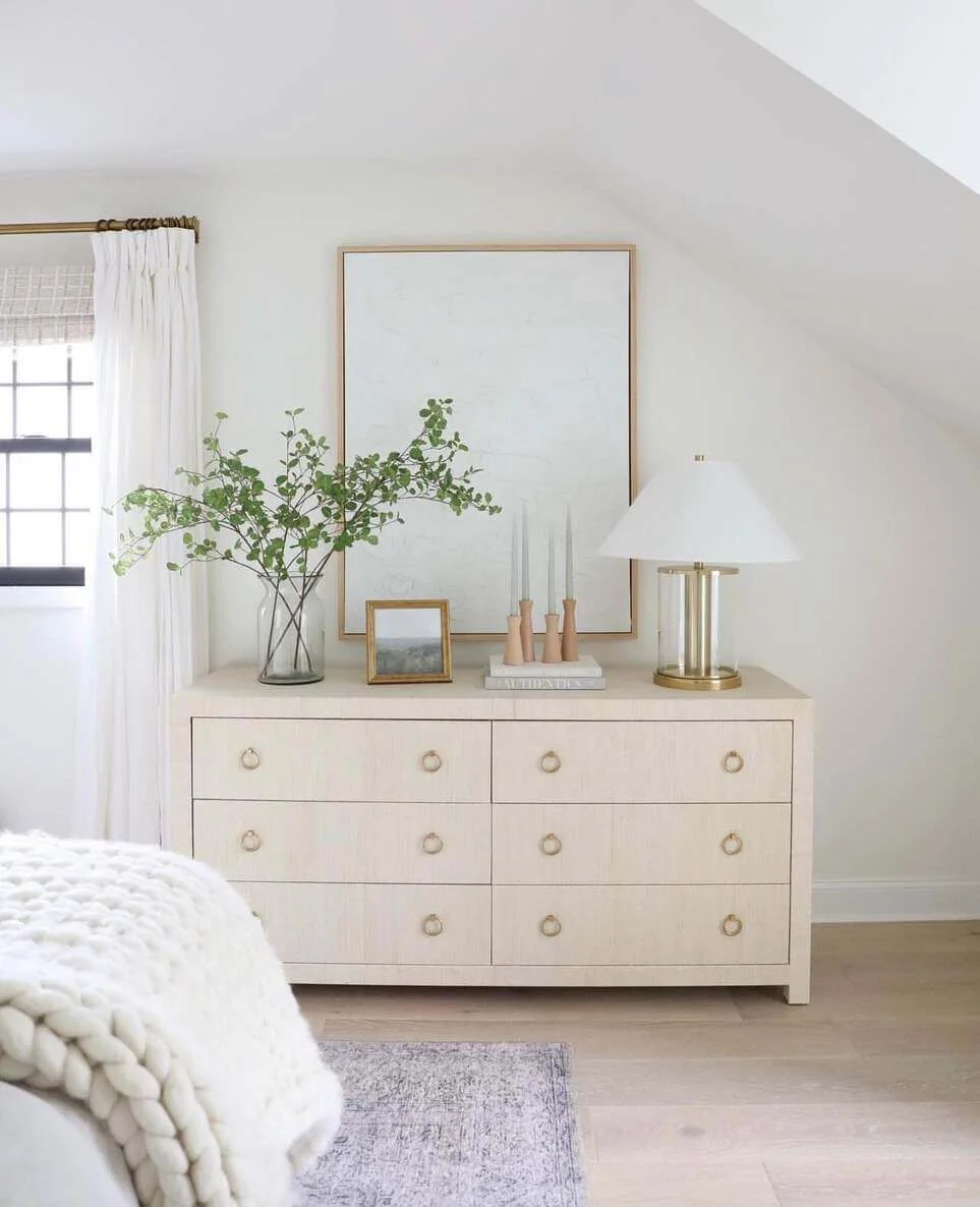Stacked Books Create a Base for Tapered Candlesticks