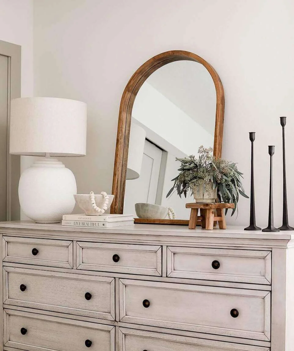 Arched Wood Mirror Frames Lamp and Books