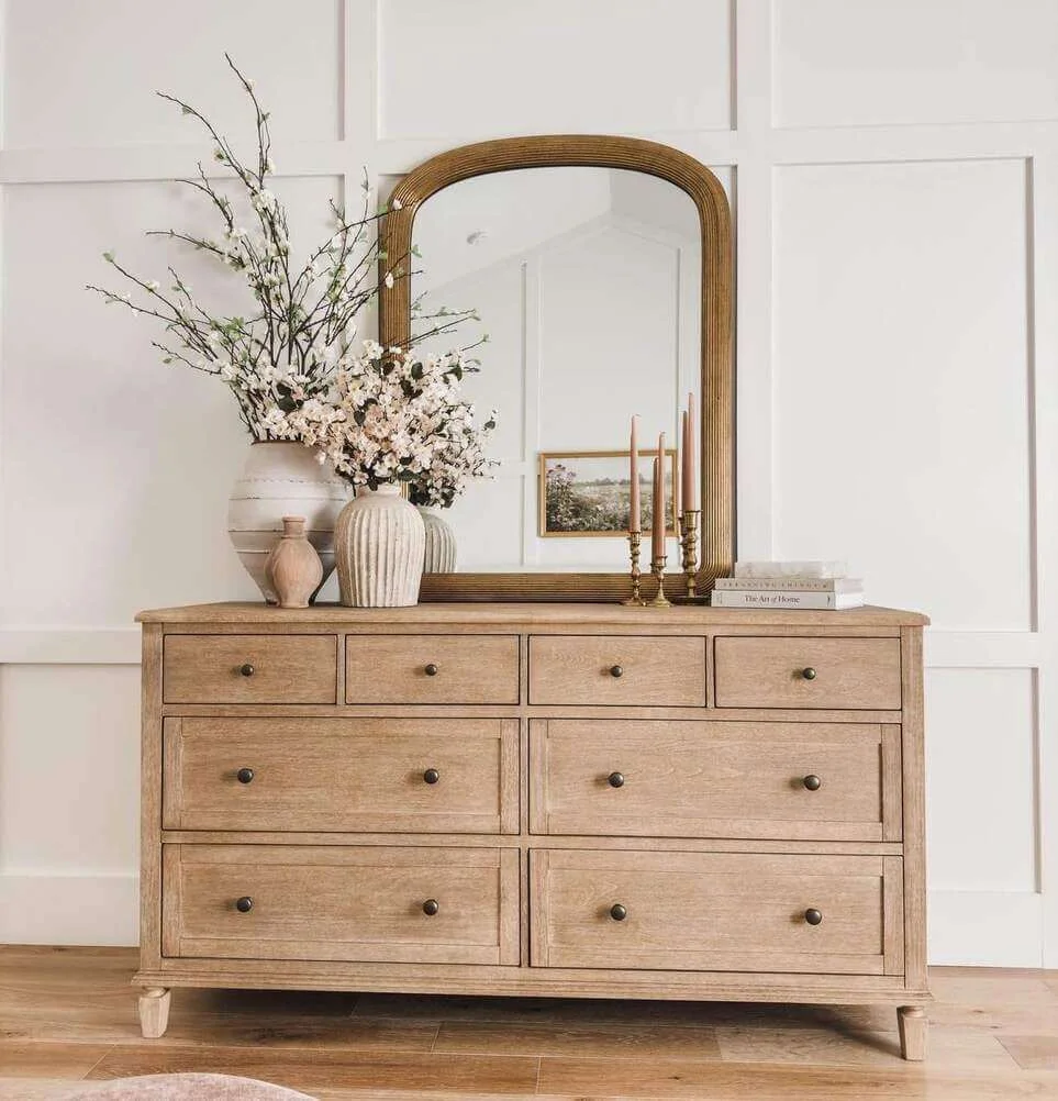 Arched Mirror Frames Tall Vase of Spring Branches