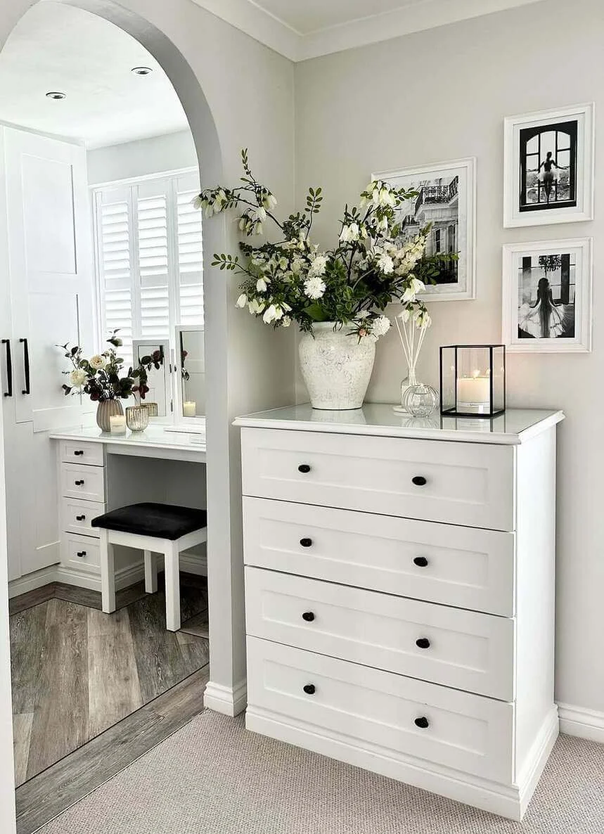 Tall White Urn Anchors a Dramatic Bouquet of White Flowers