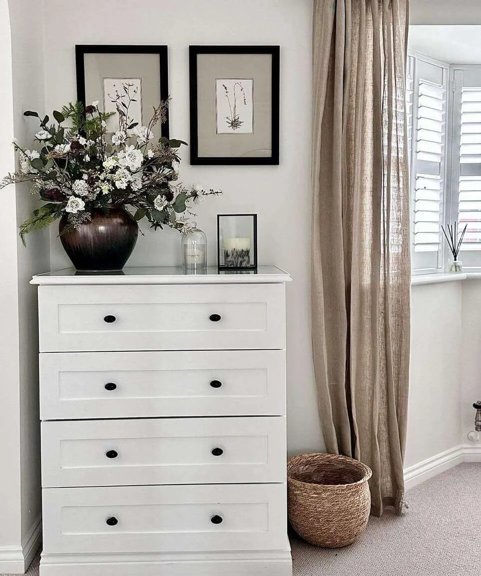 Dramatic Floral Arrangement Anchors White Dresser