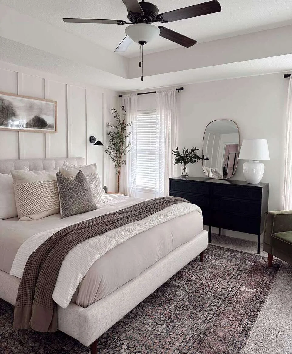 Dark Dresser Grounds the Space with a Minimalist Mirror