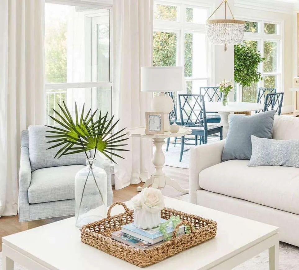 Oversized Glass Vase Holds Dramatic Palm Fronds