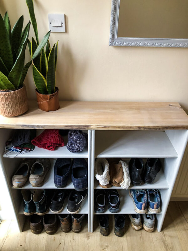 Tiered Shelving Unit Hides Clutter Under a Console Table