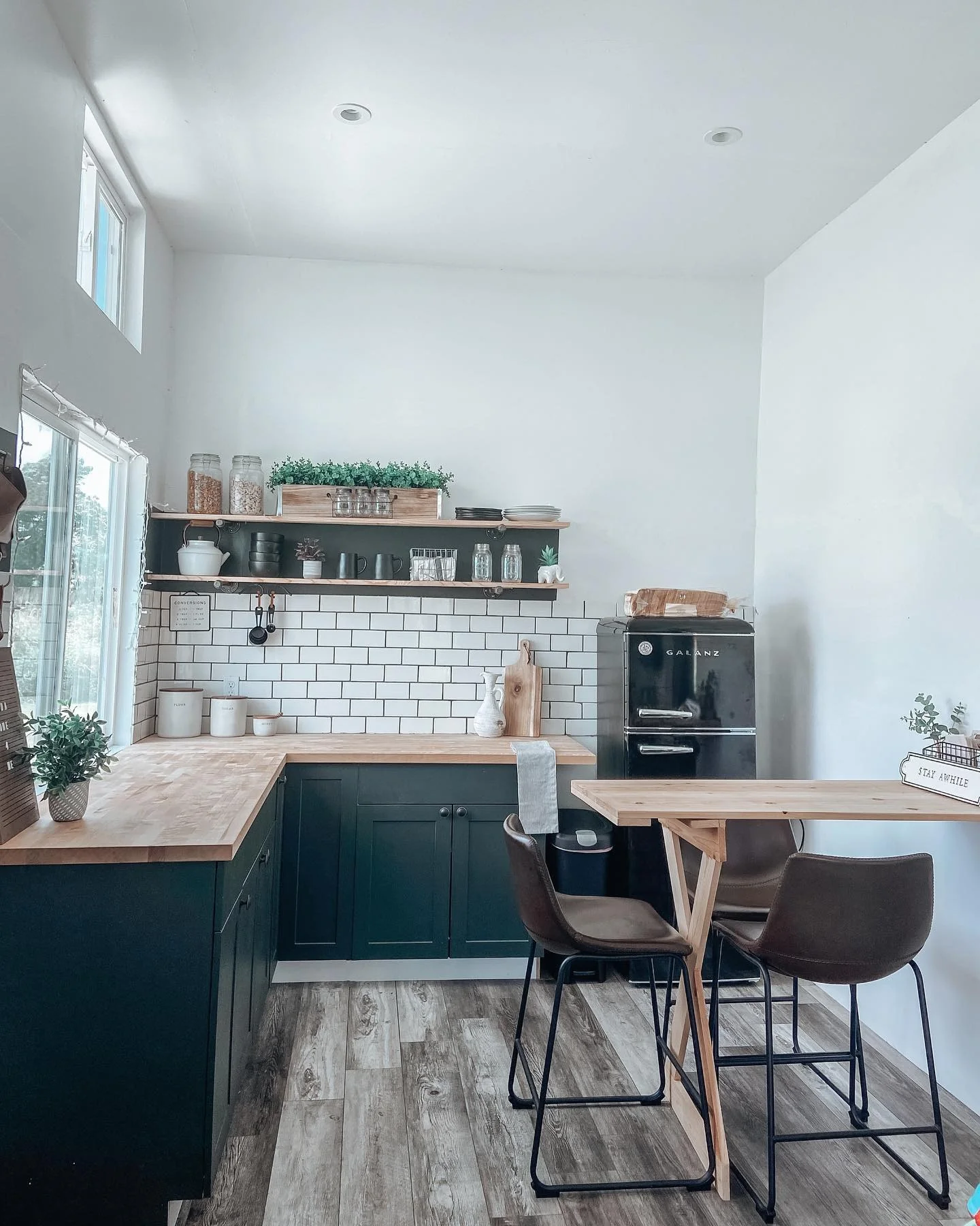 Place Greenery in a Wooden Crate on Open Shelves