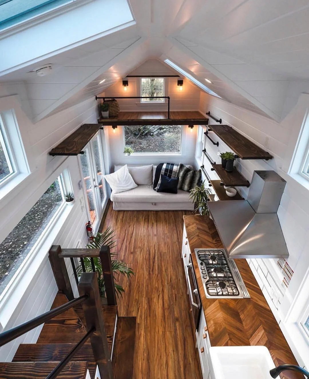 Dark Wood Shelves Add Open Storage Above Seating