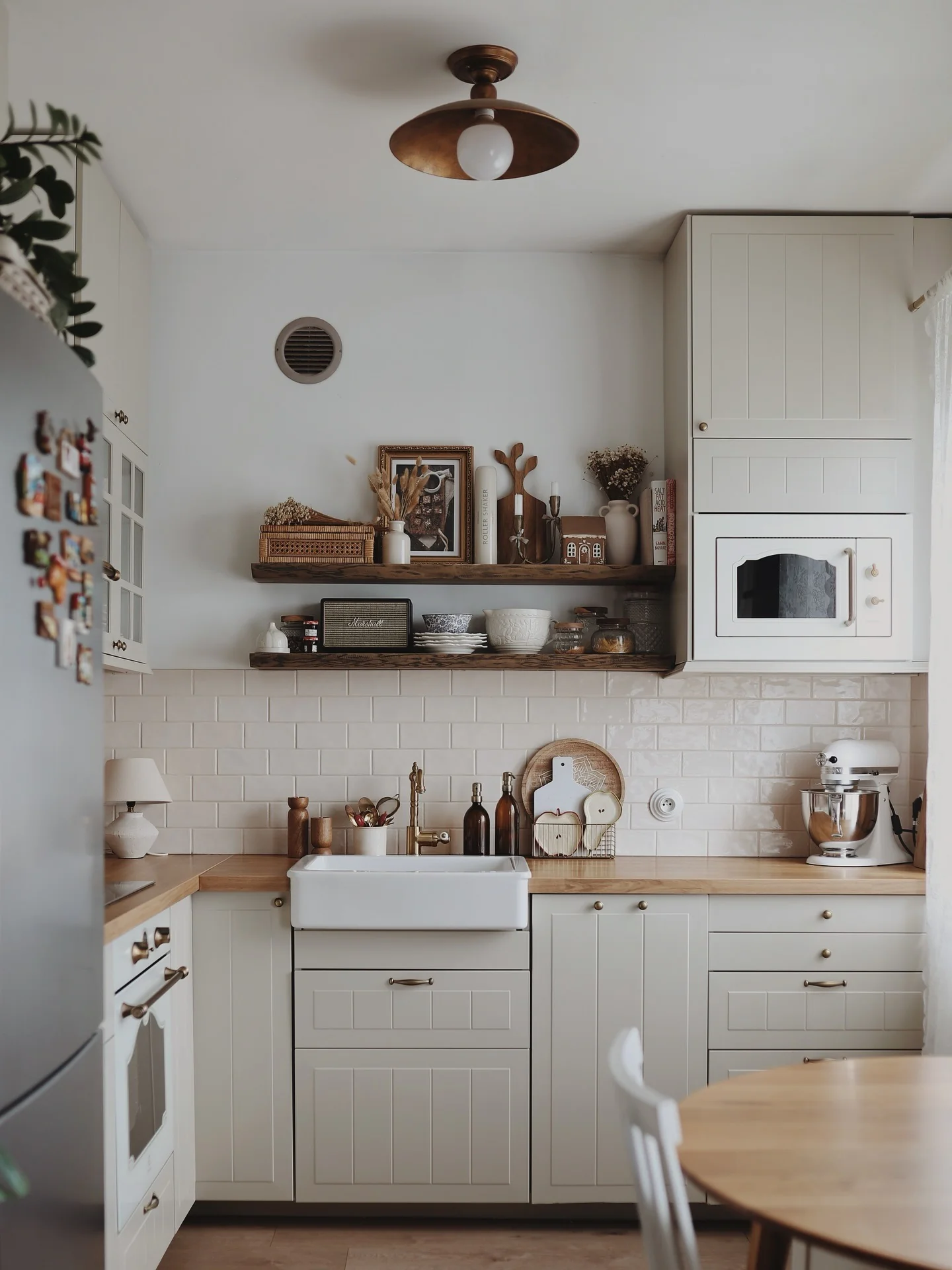 Wooden shelves add rustic charm and display space above the counter
