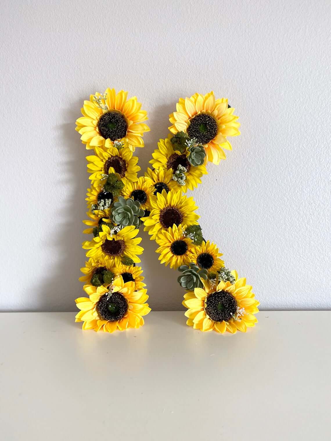 Freestanding Letter Form Dressed in Sunflowers and Succulents