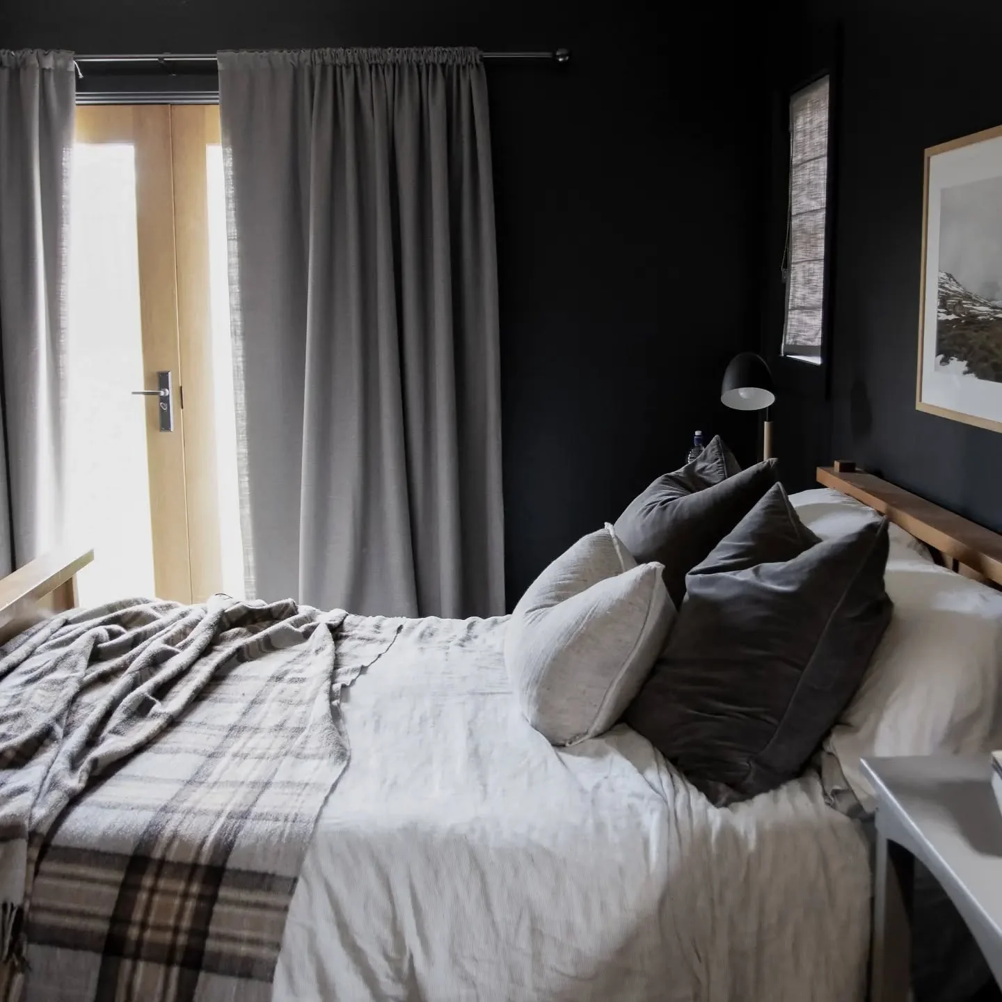 Layer Velvet Pillows for Cozy Depth Against Black Walls