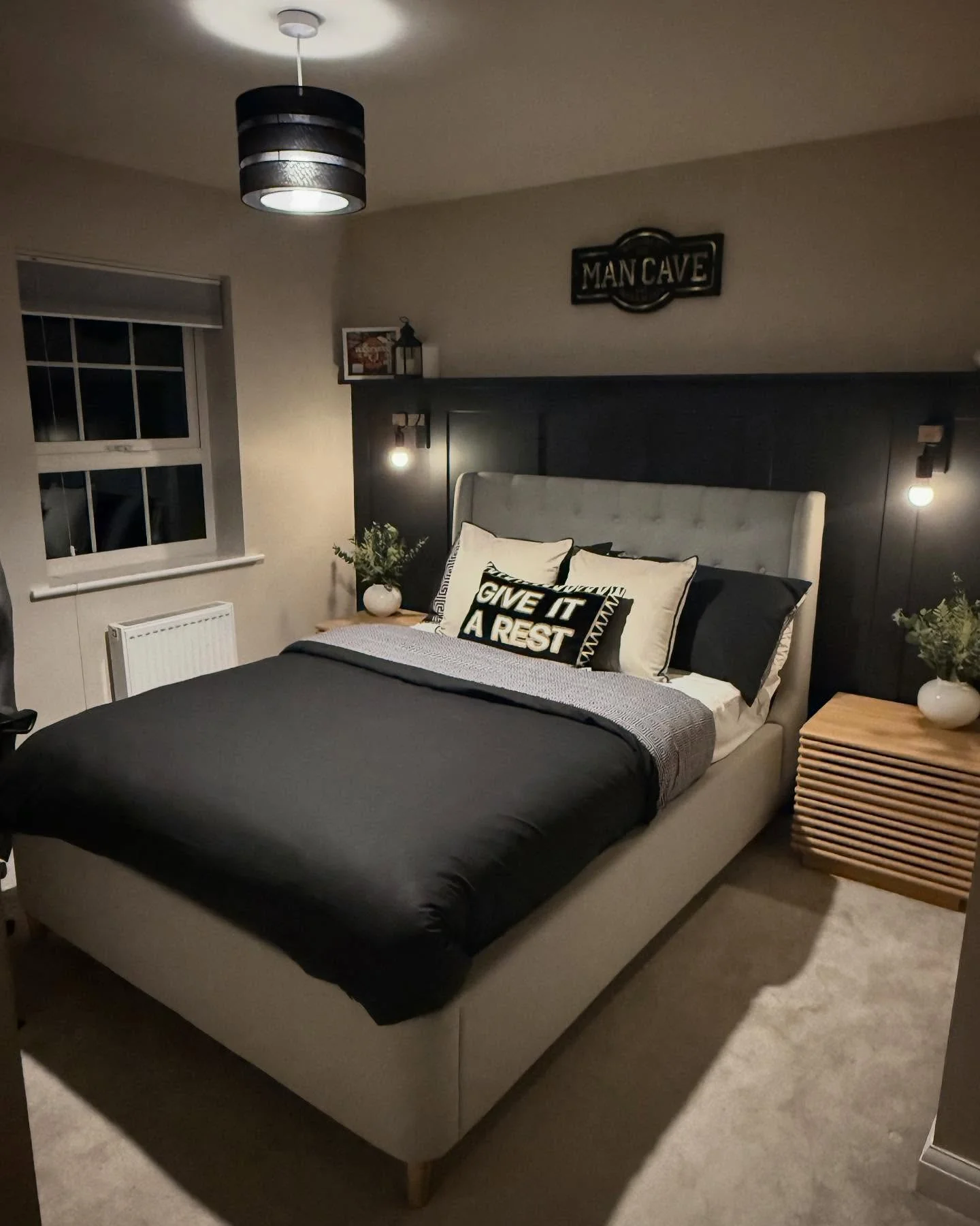 Dark Paneled Headboard Wall Adds Dramatic Depth
