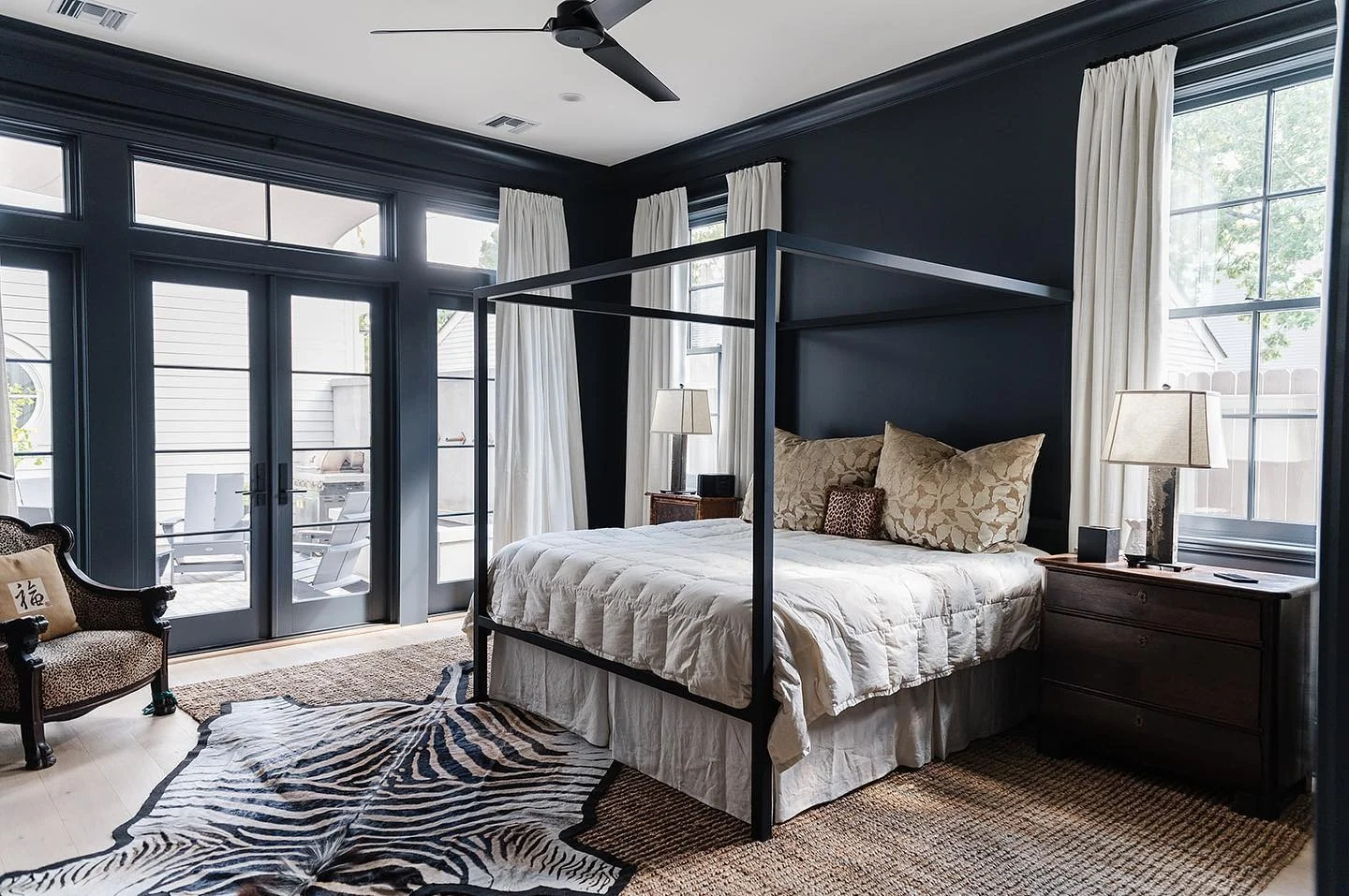 Anchor Your Black Wall with a Sleek Canopy Bed