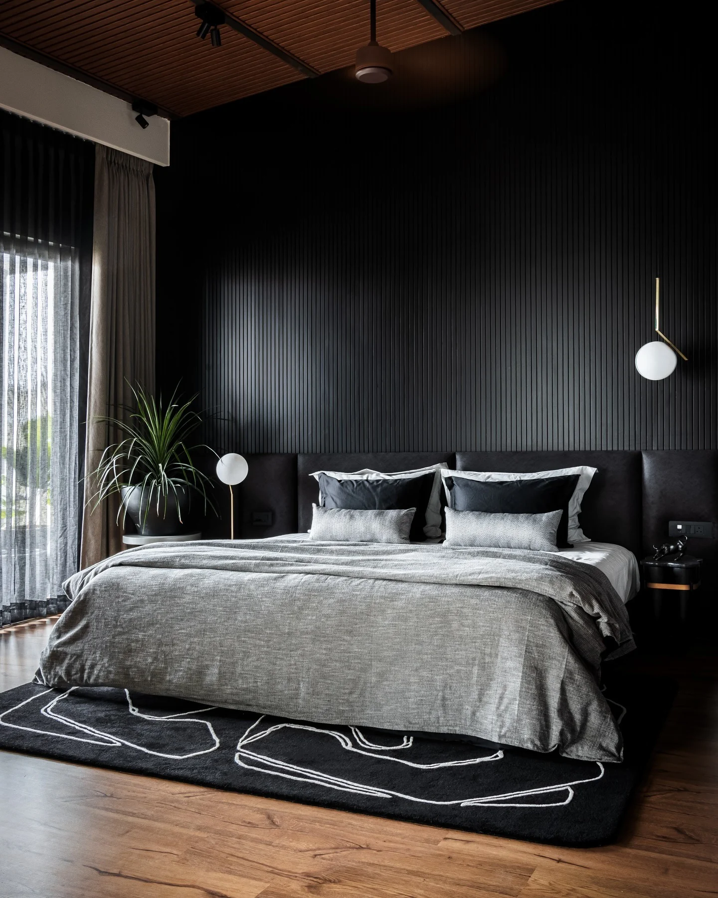 Ground Your Dark Bedroom with a Graphic Rug