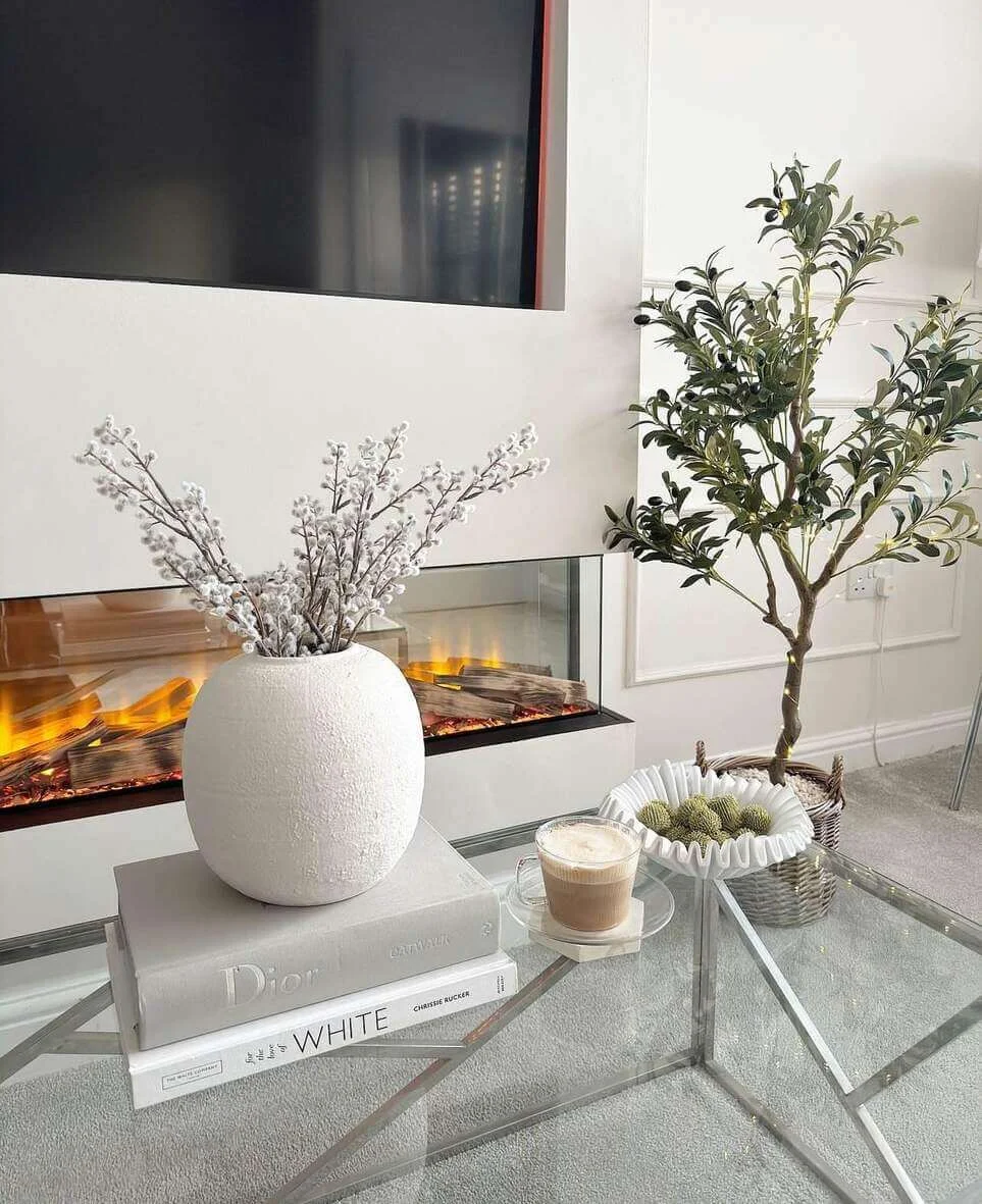 Textured White Vase Anchors Book Stack Display