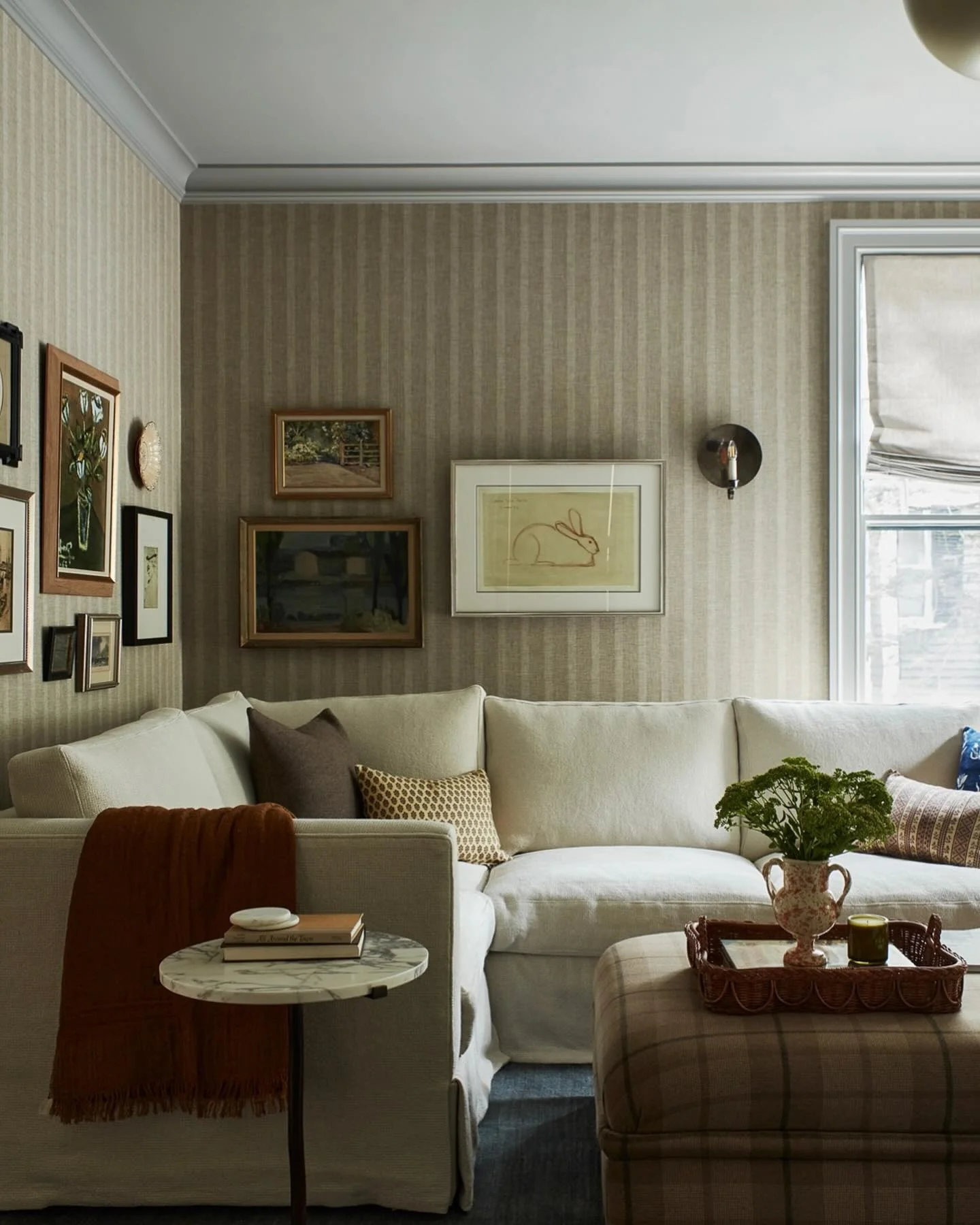 Framed Bunny Sketch Adds Delicate Whimsy to Striped Walls