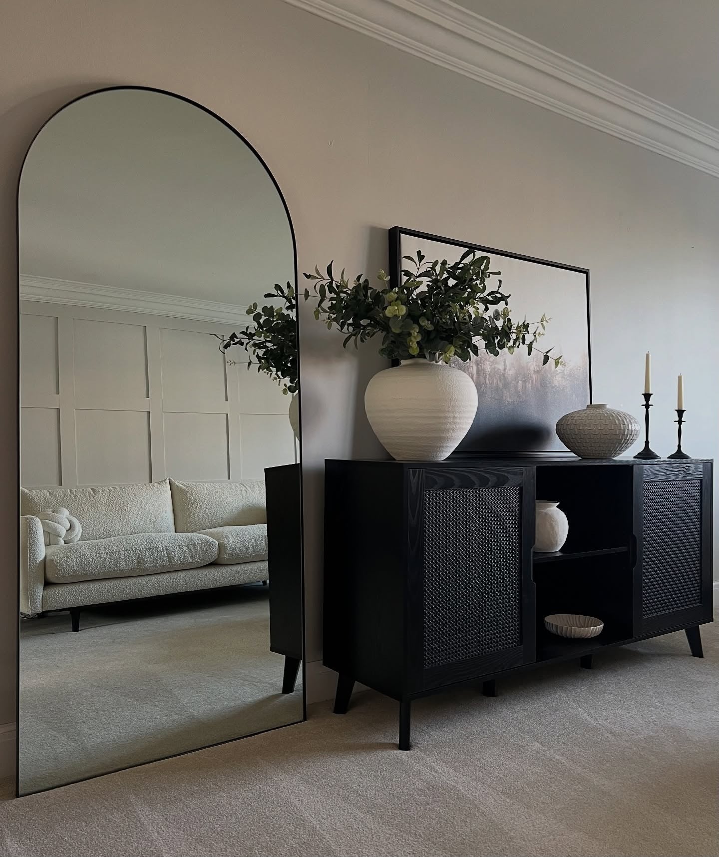 Tall Arched Mirror Reflects Light and Adds Depth