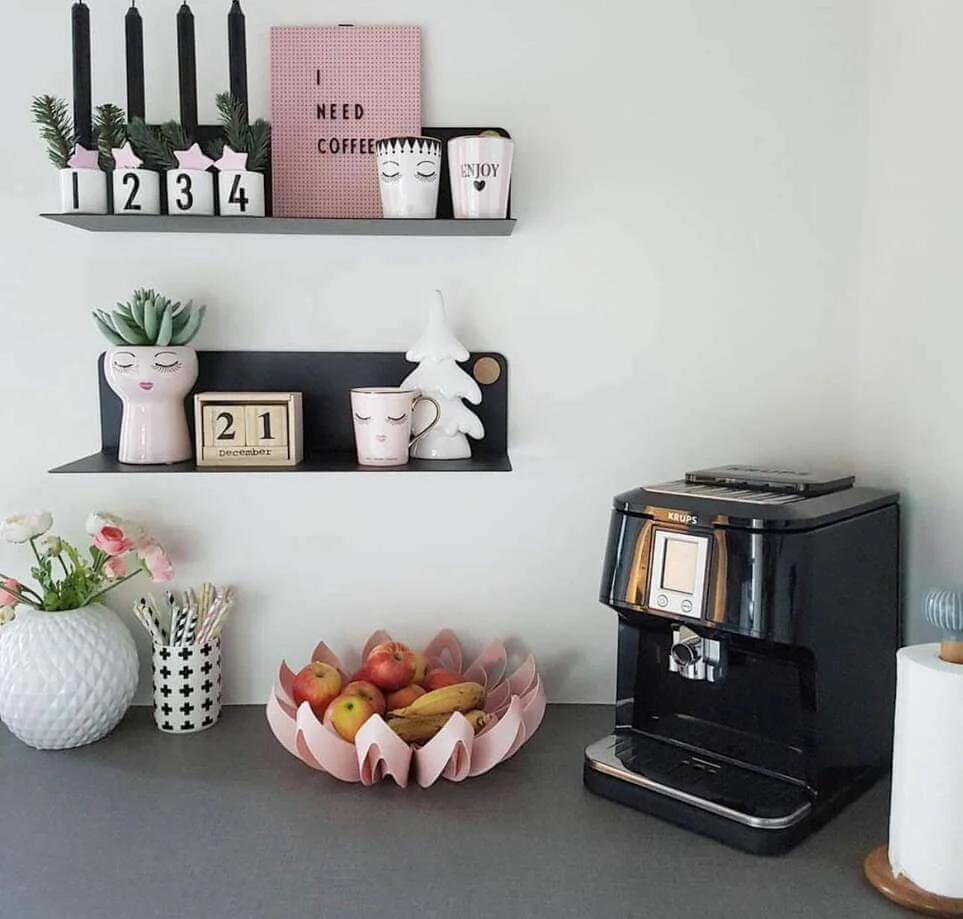 Pink Face Planter Holds Succulents on a Narrow Shelf