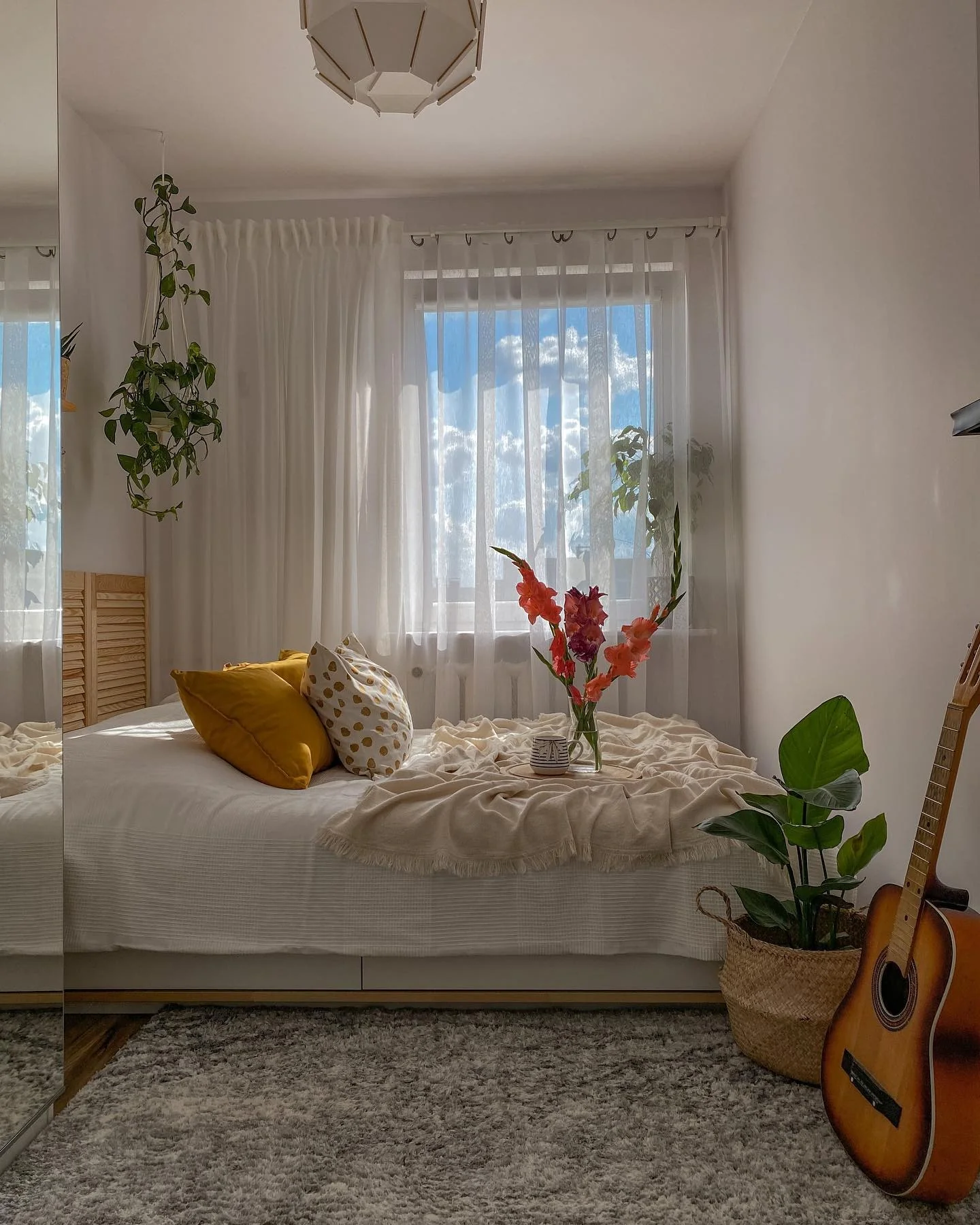 Hanging plant adds life to a small bedroom corner