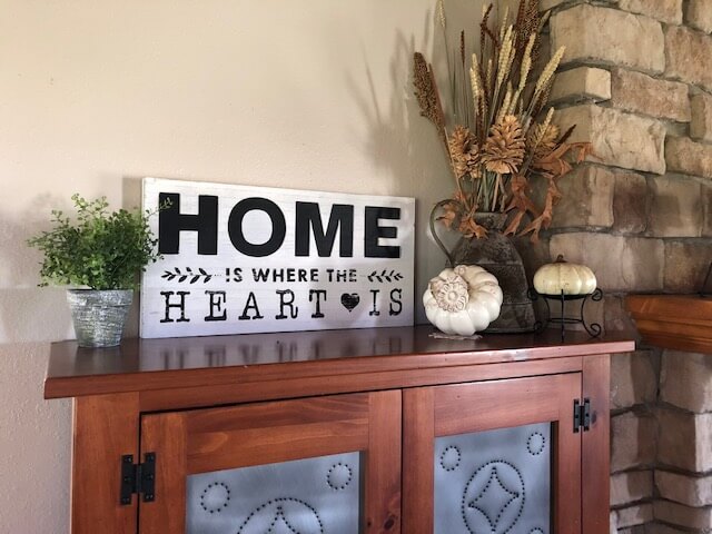 Rustic Wooden Sign with Heart and Arrow Motifs