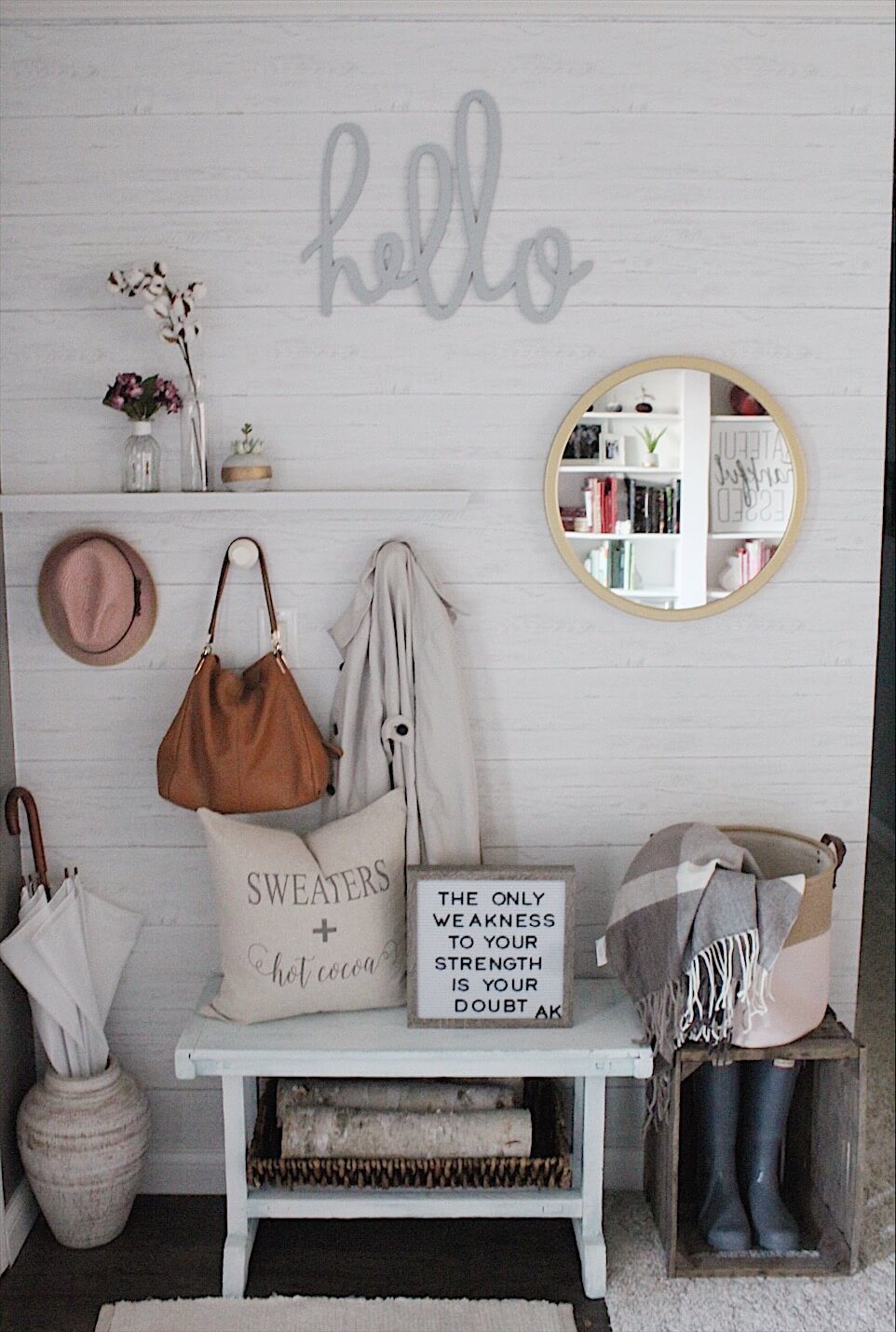 Round Mirror Reflects Bookshelf for Added Depth