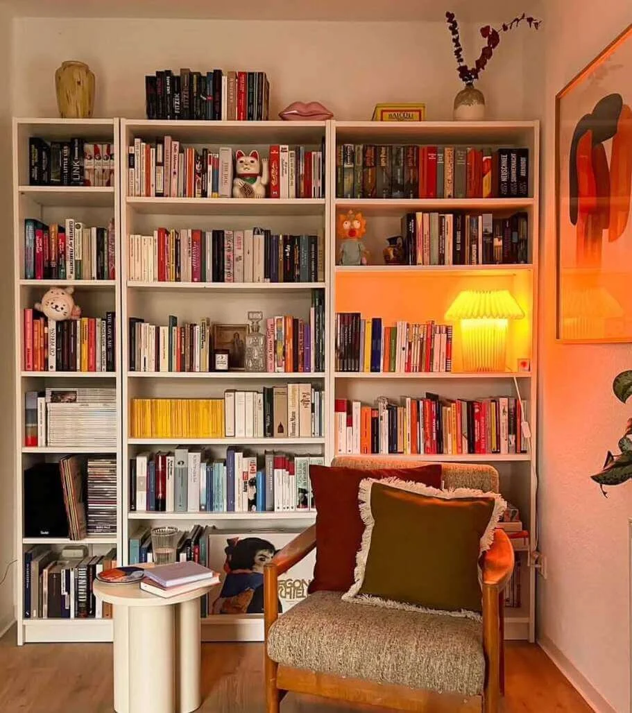 Pleated Lamp Adds Warm Ambiance to Bookshelf Display