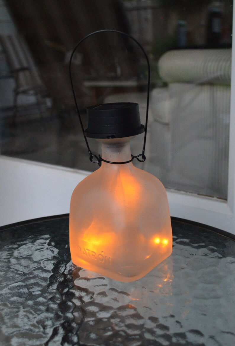 Frosted Bottle Solar Lantern Creates Ambient Garden Glow