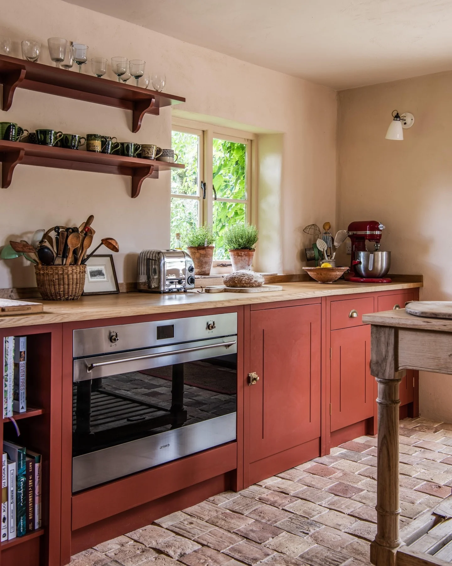 Daring Red Cabinets With Open Shelving Above
