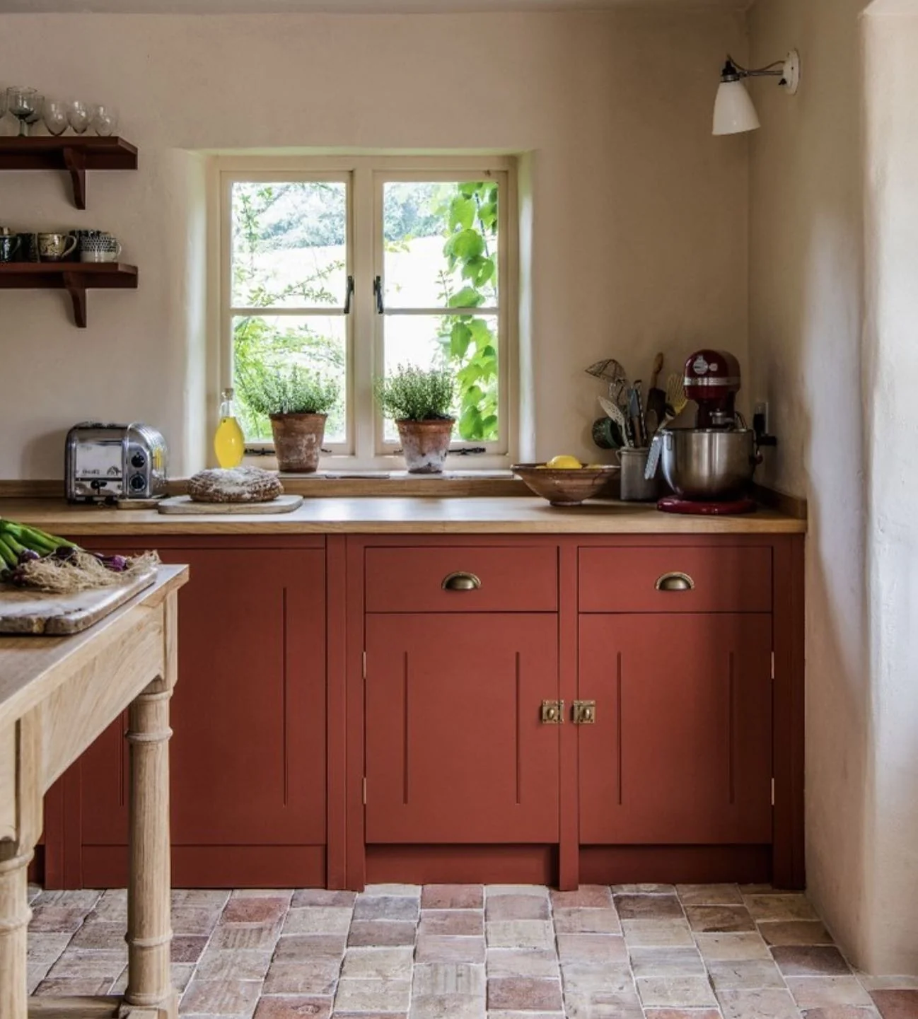 Warm Up Your Kitchen with Deep Terracotta Cabinets and Aged Brass Hardware