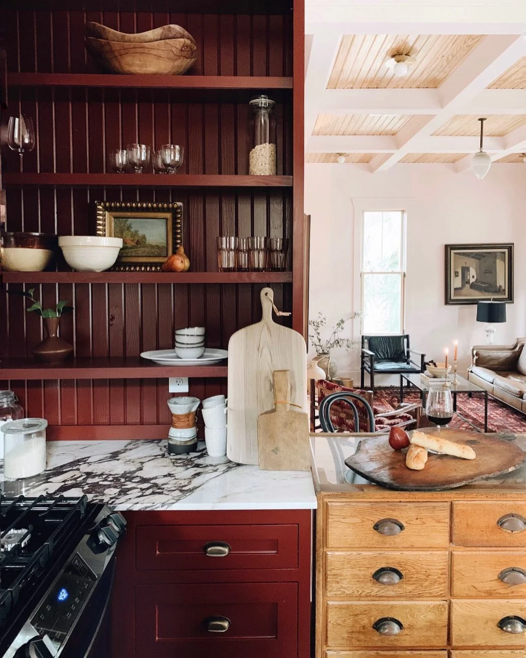 Deep Red Cabinetry With Open Shelving Displays
