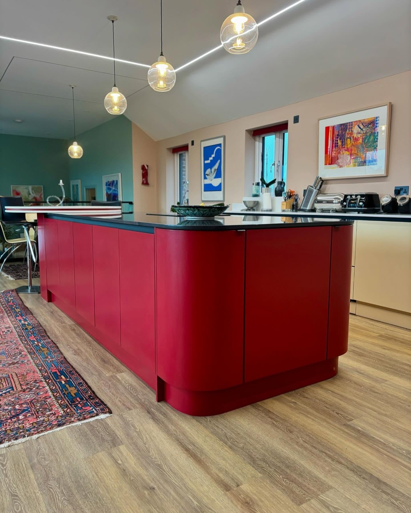 Soften Your Kitchen with a Curved Red Island