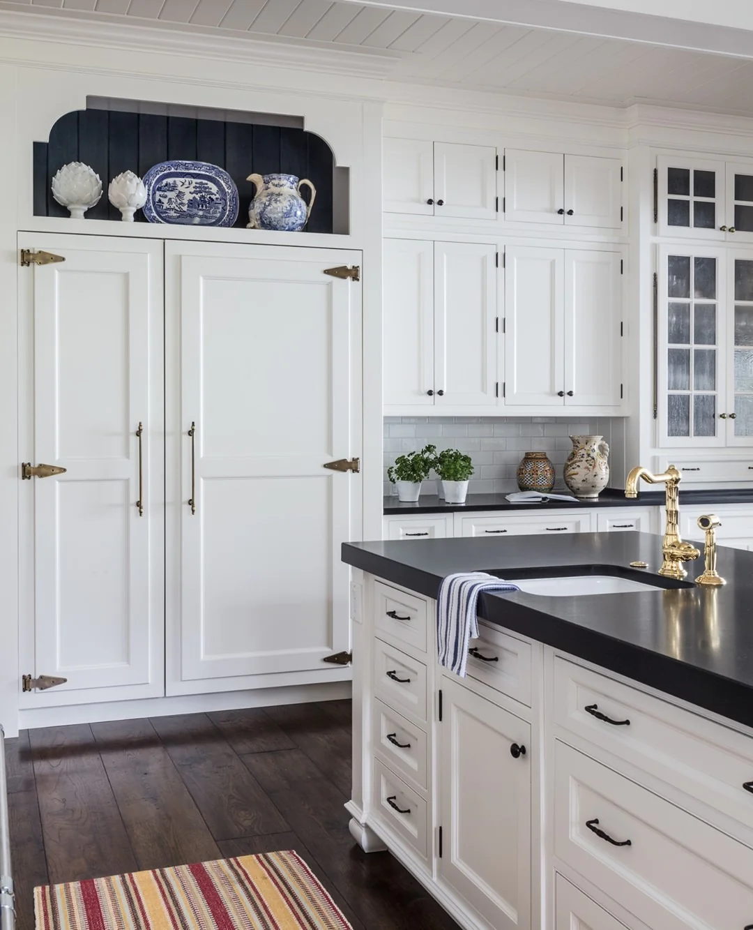 Displaying Blue and White Ceramics Above Integrated Appliances