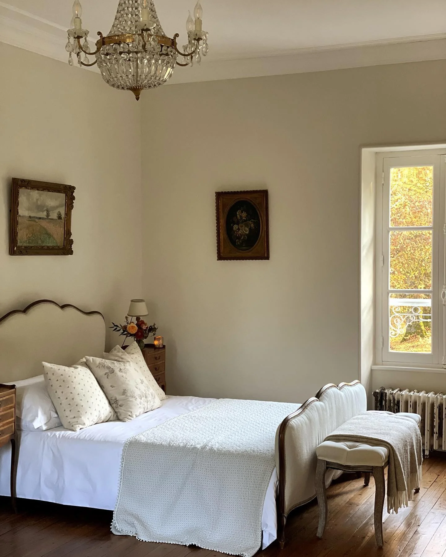 Crystal Chandelier Adds Sparkle to a French Bedroom