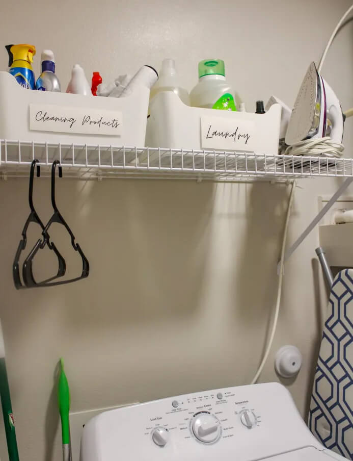 White Bins with Handwritten Labels for Cleaning Products and Laundry Supplies