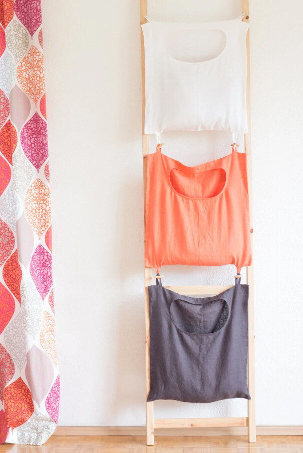 Sort Laundry by Color Using Hanging Linen Bags on a Ladder Rack