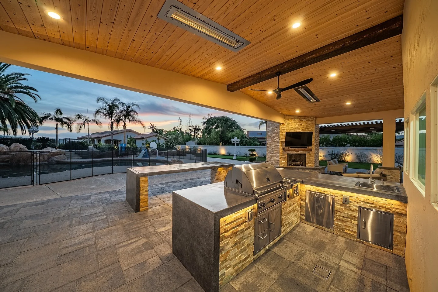 Concrete Countertops Extend Over a Stacked Stone Base