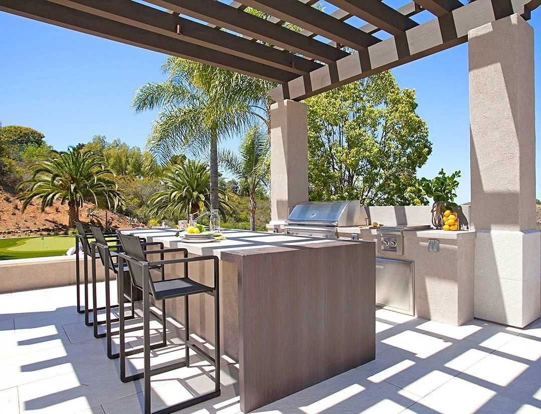 Built-in Grill and Bar Seating for Unified Entertaining