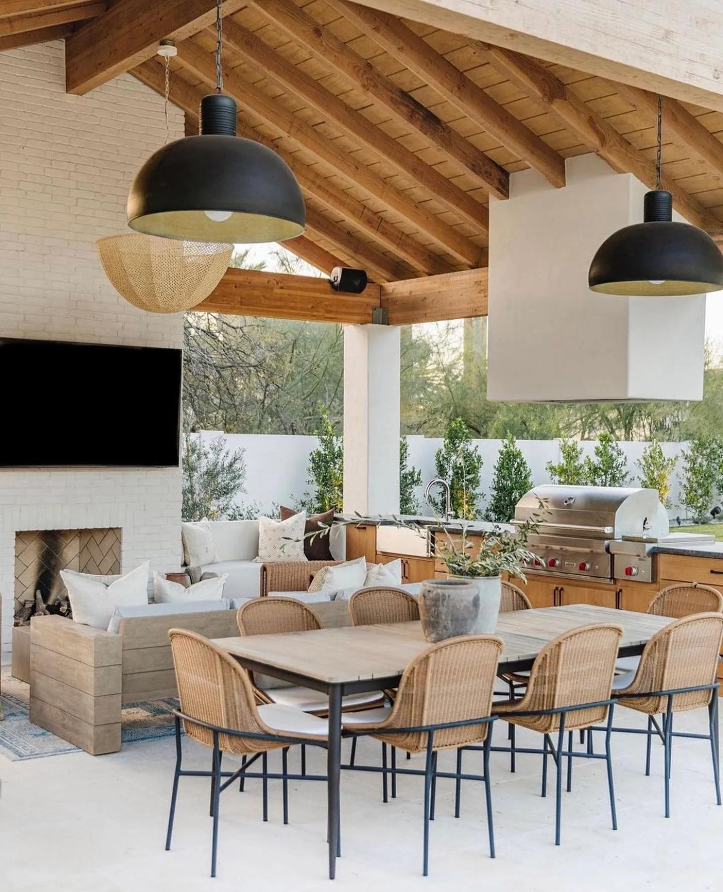 Oversized Black Pendants Define Outdoor Kitchen Zones