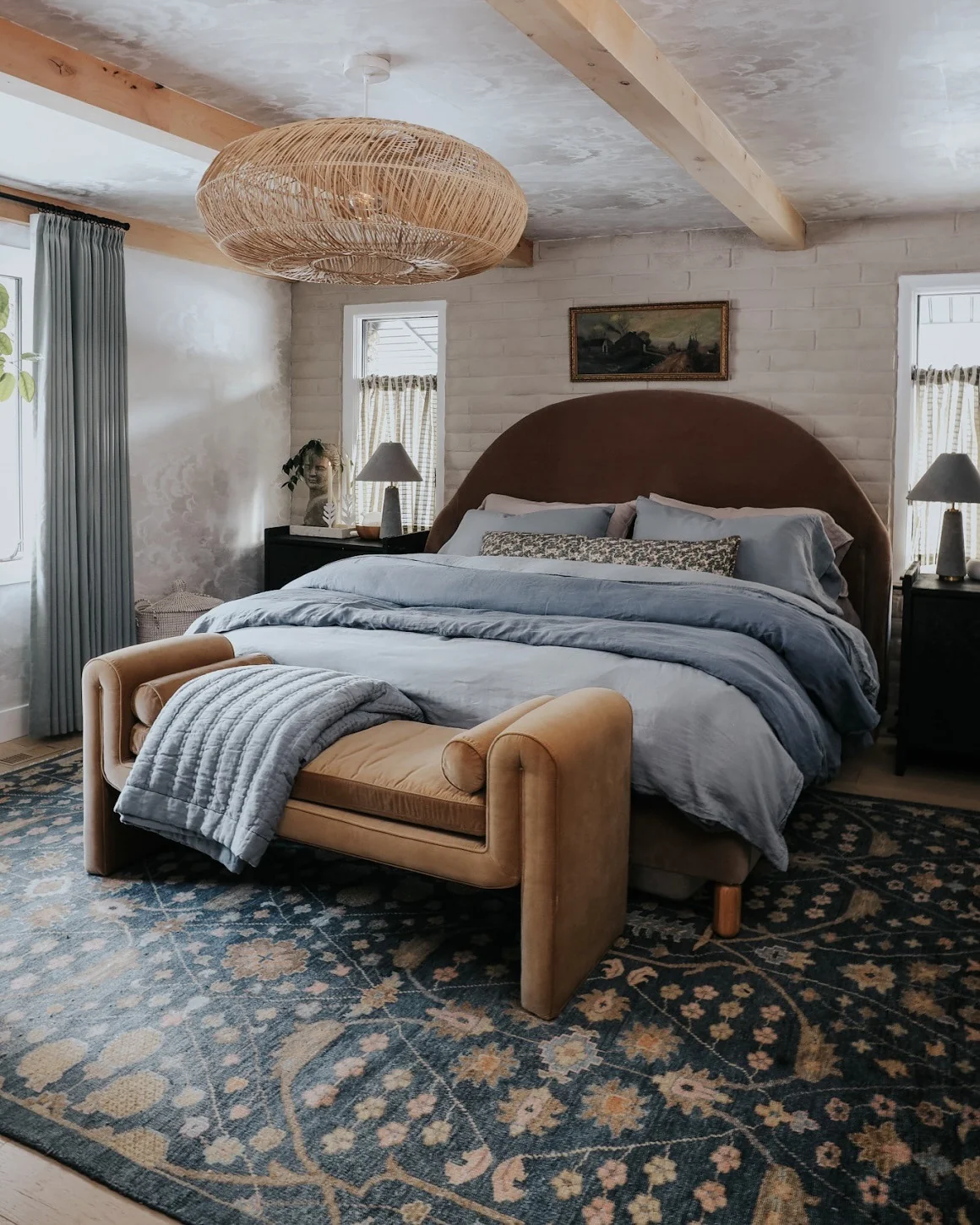 Curved Bench Adds a Soft Silhouette at the Foot of the Bed