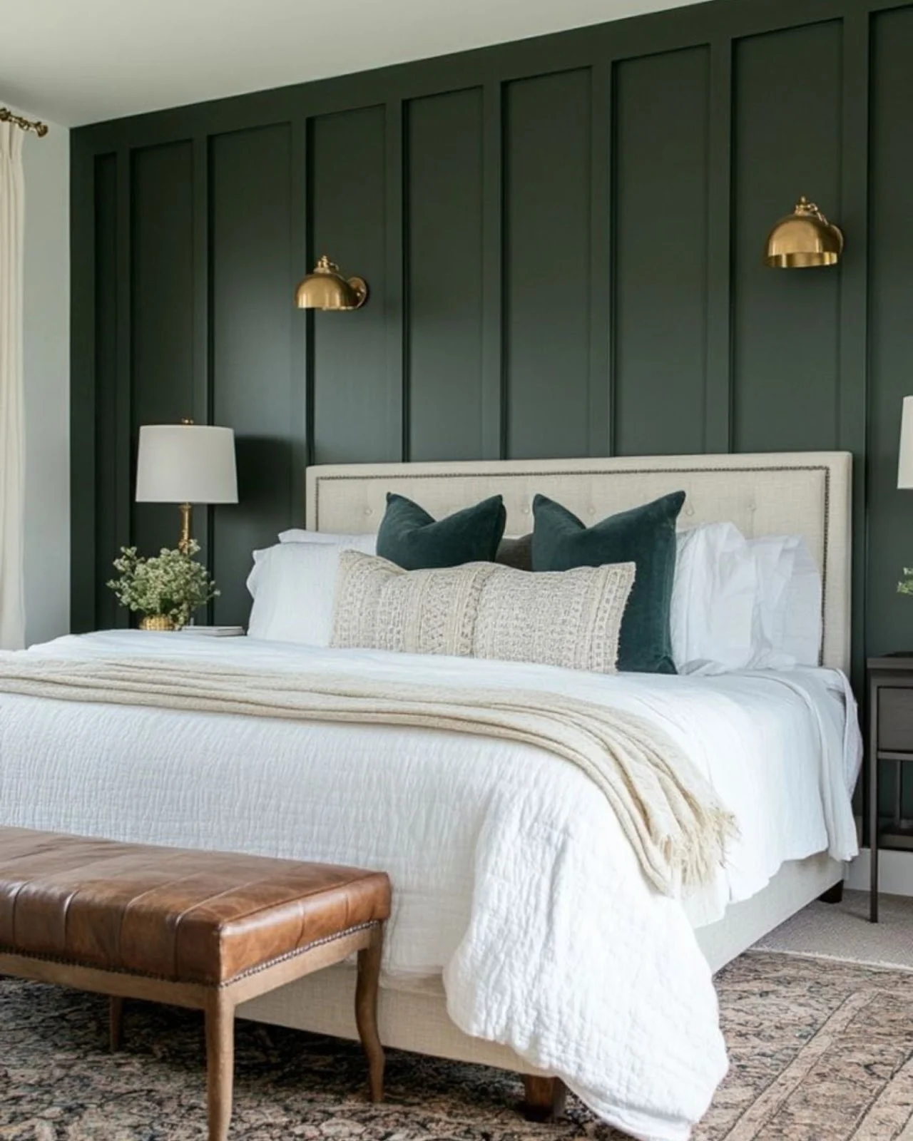 Brass Dome Sconces Add Warmth to Vertical Green Paneling