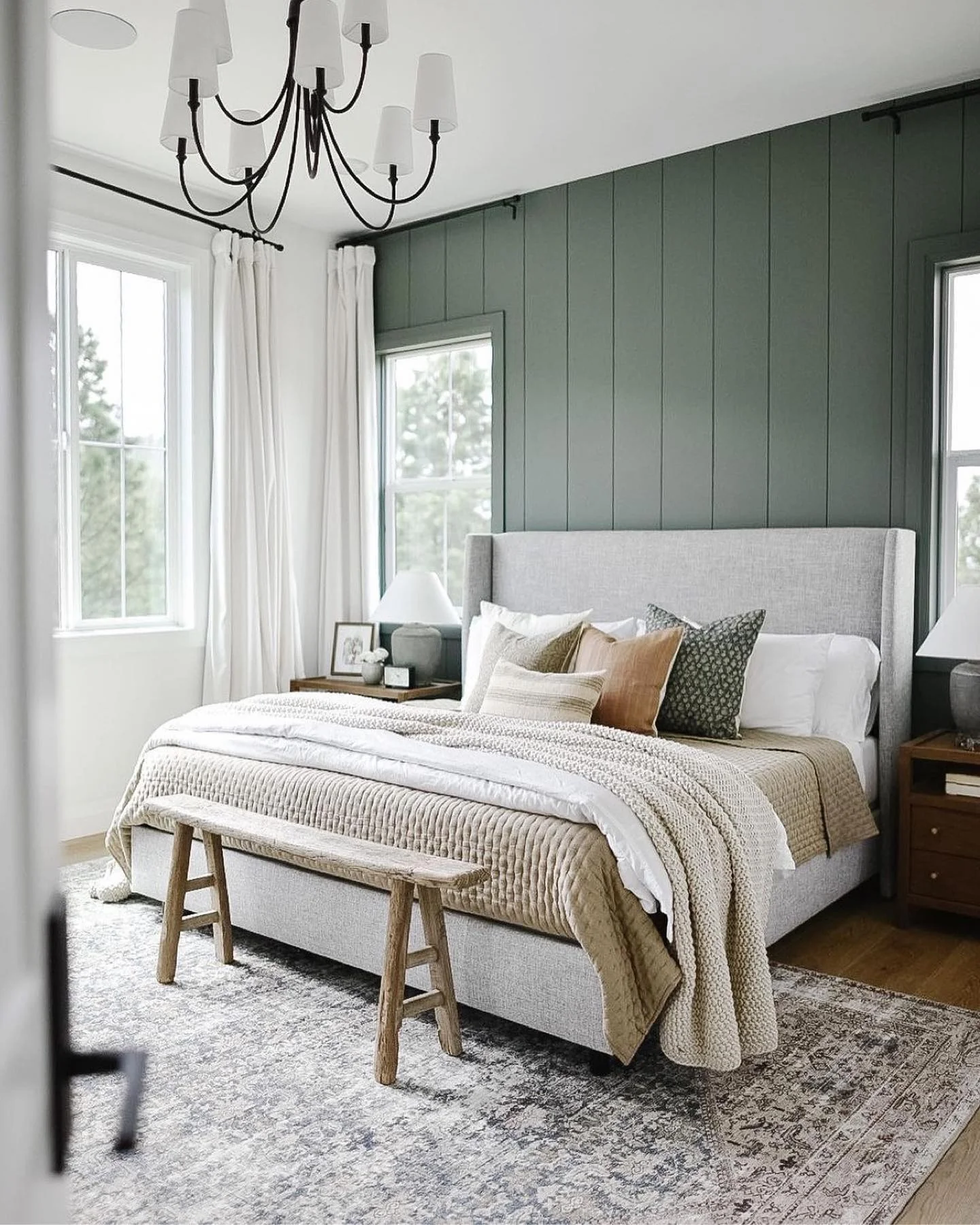 Deep Green Vertical Paneling Creates a Moody Bedroom Backdrop