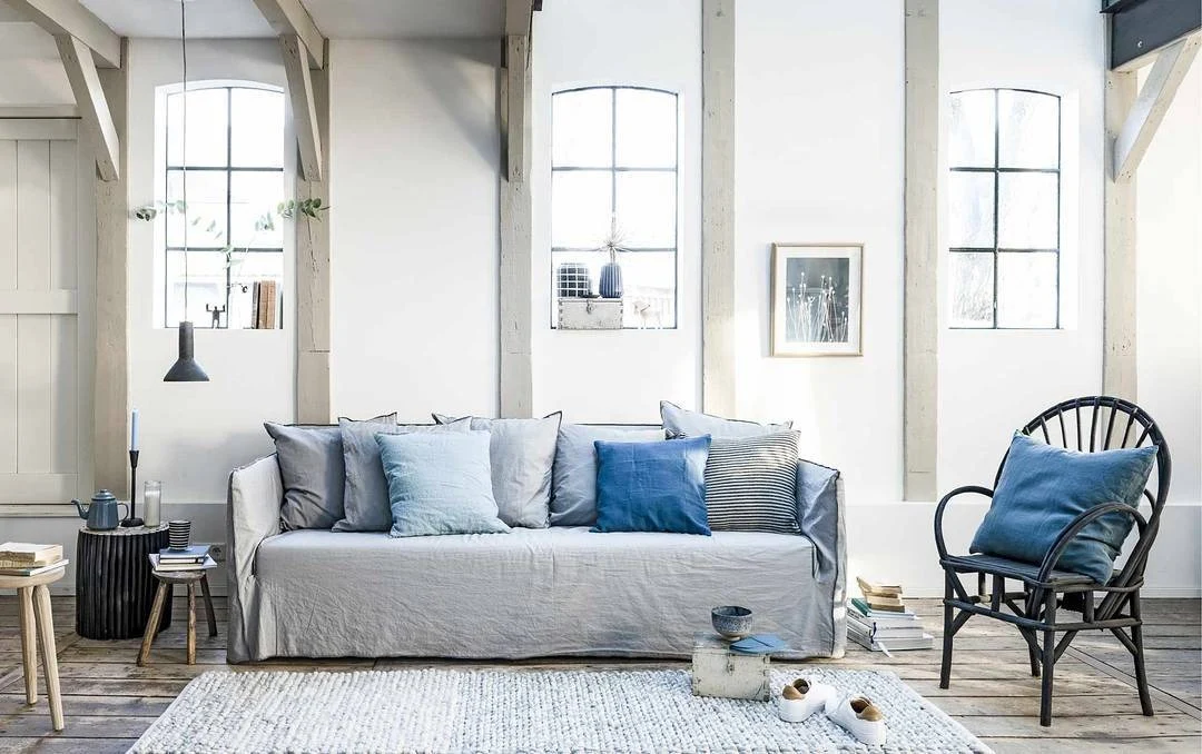 Slipcovered Sofa with Mixed Blue Pillow Textures