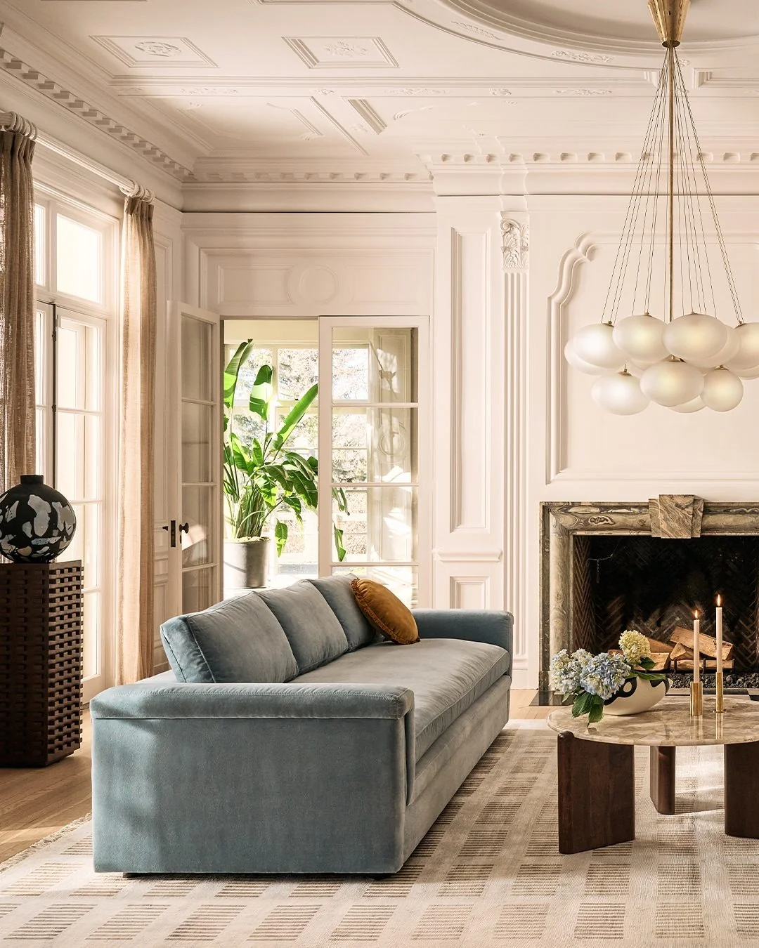 Soft Blue Sofa with a Single Mustard Accent Pillow