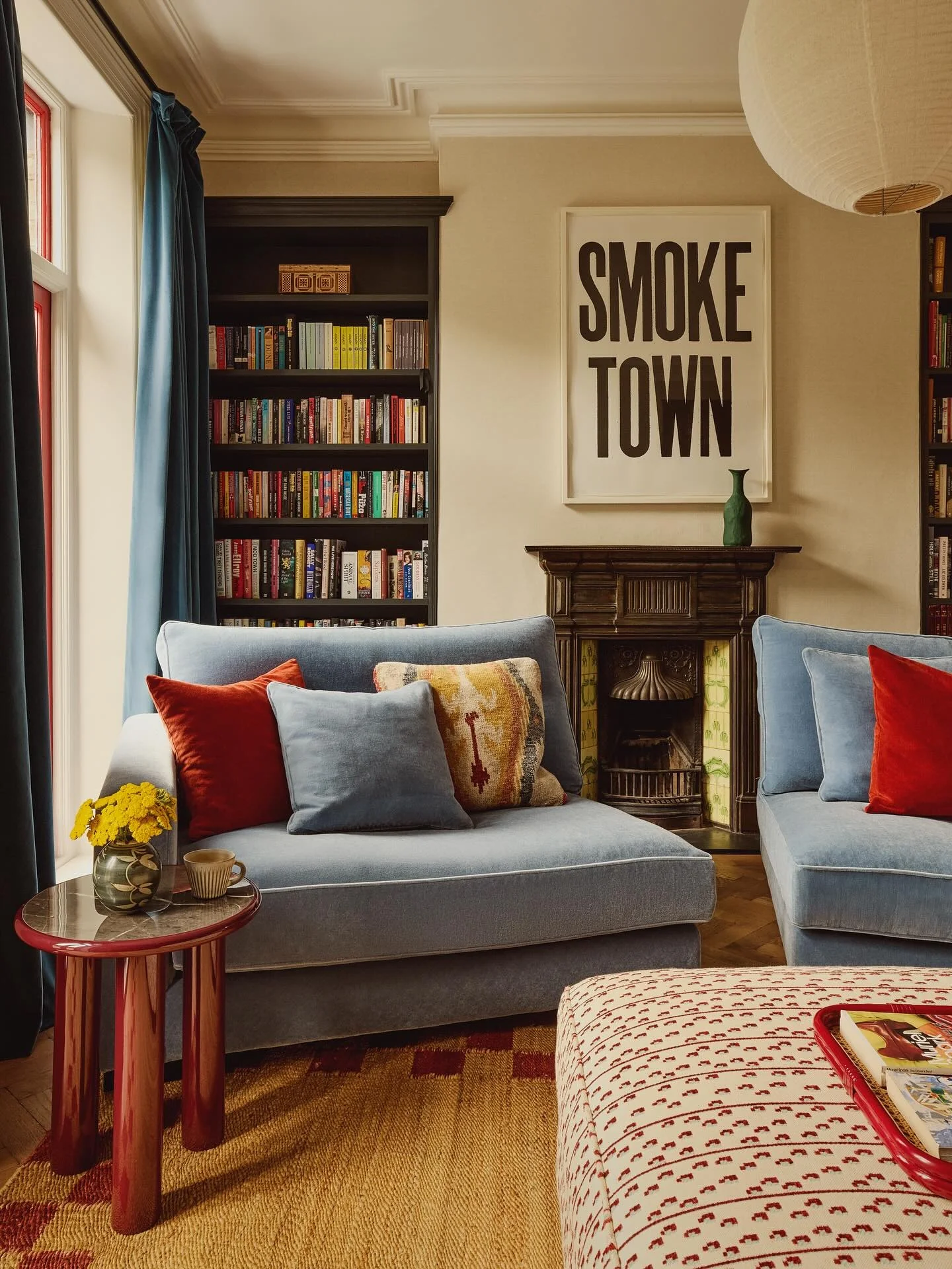 Graphic Text Art Above a Dark Fireplace Mantel