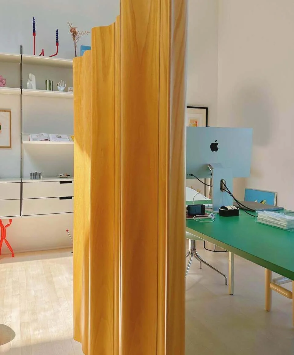 Curved Wood Panel Softens Office Divisions