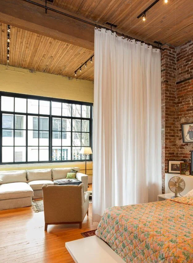Floor-to-Ceiling Sheer Curtains Soften Divisions