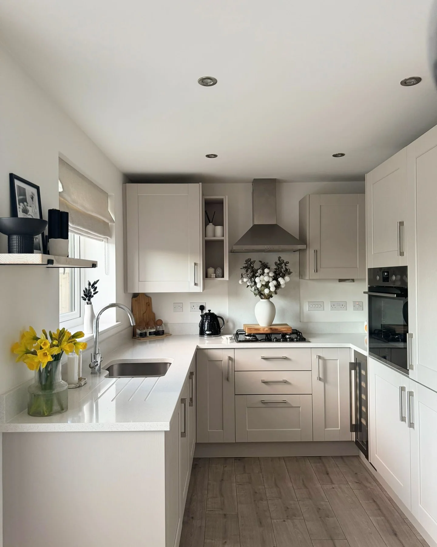 White Cabinets With Integrated Stainless Steel Range Hood