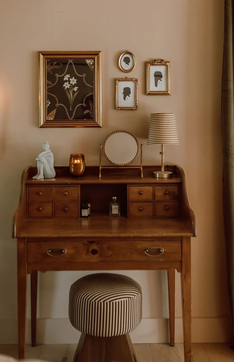 Gallery Wall Above a Vintage Wooden Vanity